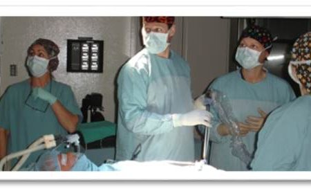 Practitioners in the middle of a procedure.